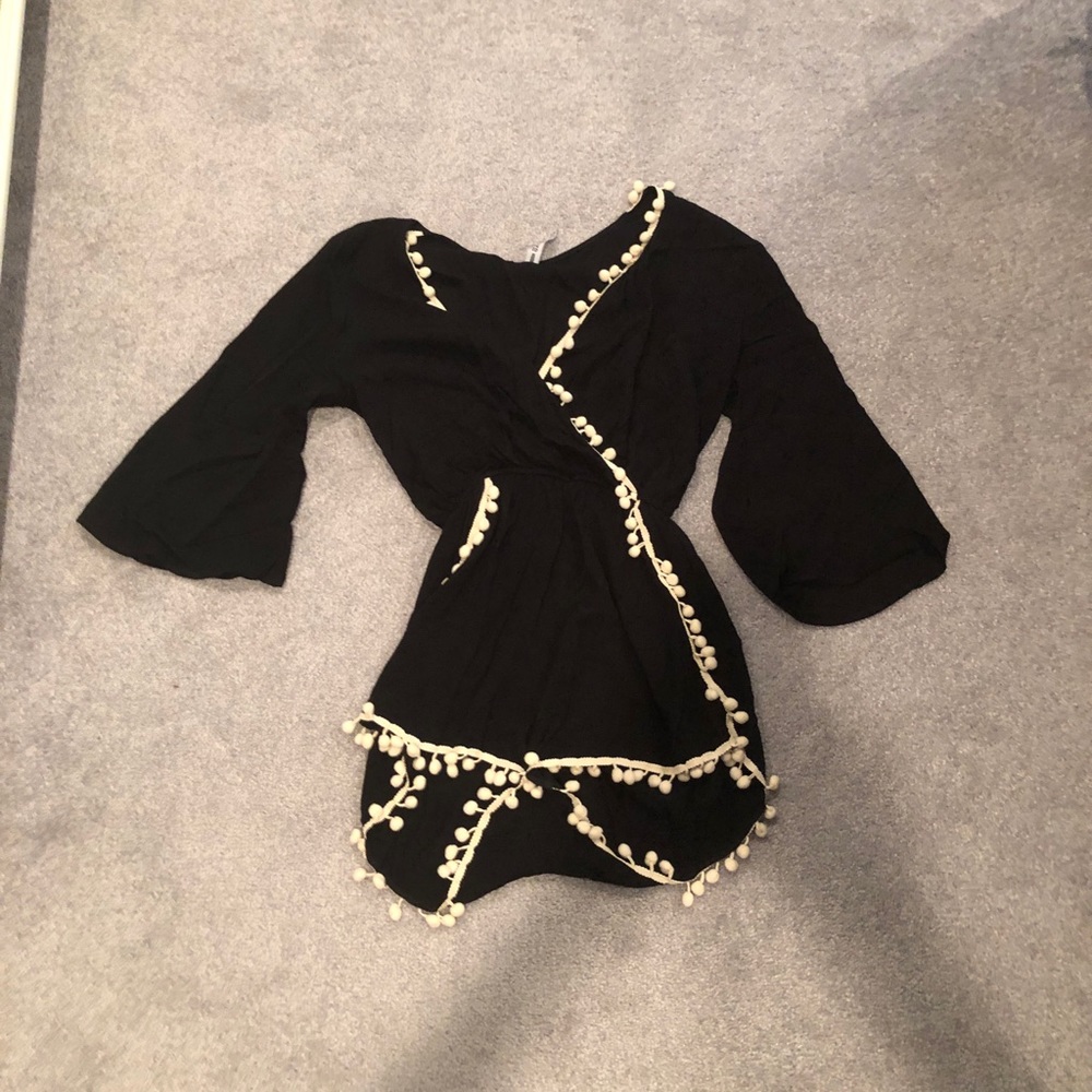 Black romper with white pom-poms design lab